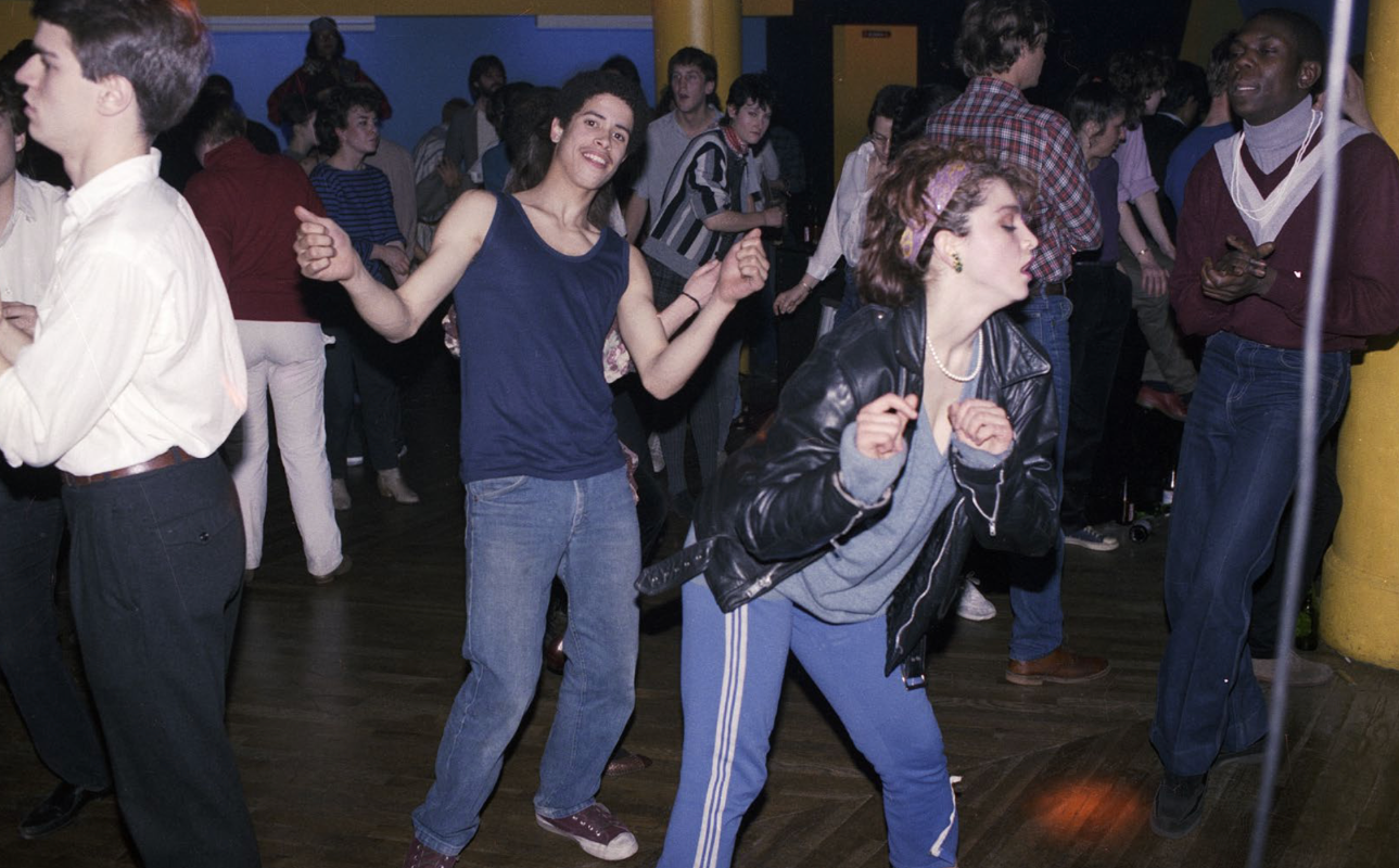 Crazy Legs dancing beside Madonna on a crowded club floor, pages 216–217