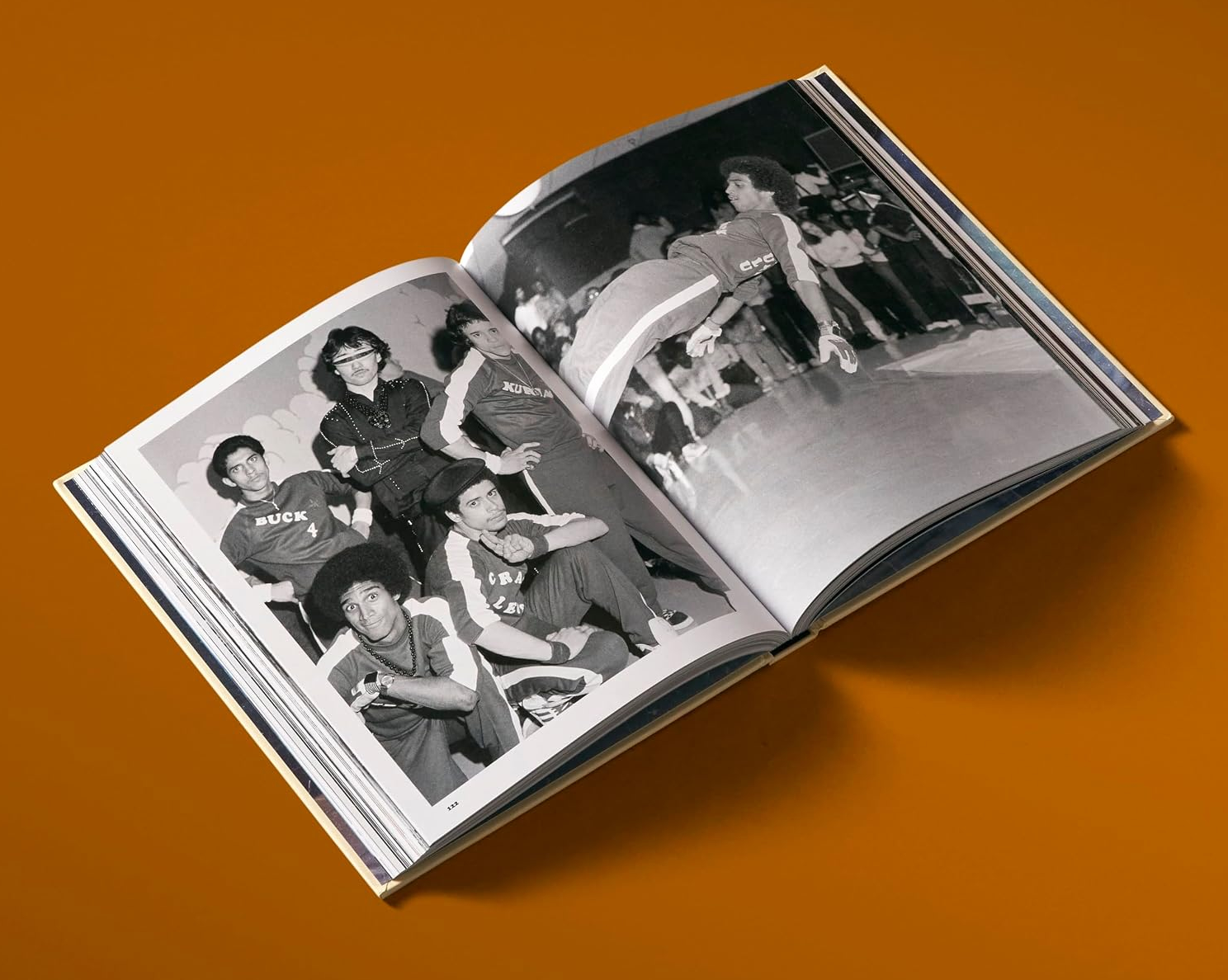 Open spread from the book showing Rock Steady Crew group portrait and a mid-air dance photograph